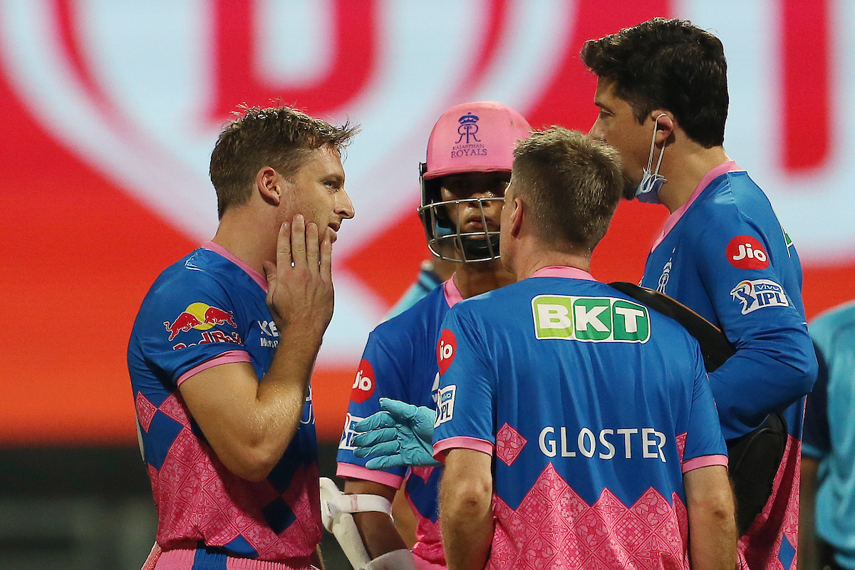 Jos Buttler of Rajasthan Royals holds his chin after a delivery from Pat Cummins of Kolkata Knight Riders