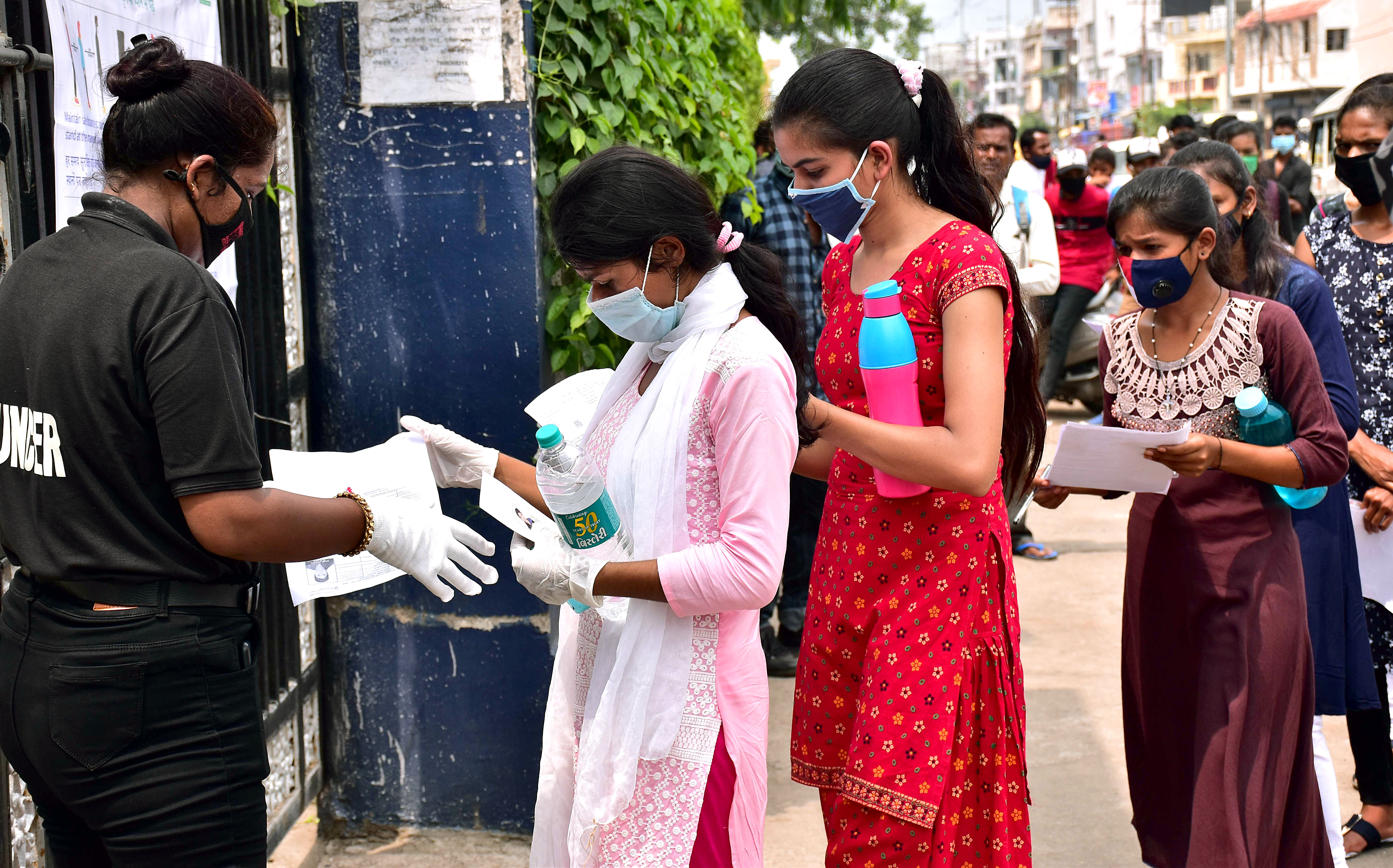 Students getting their documents verified outside an exam centre as they arrive to appear for the NEET exam