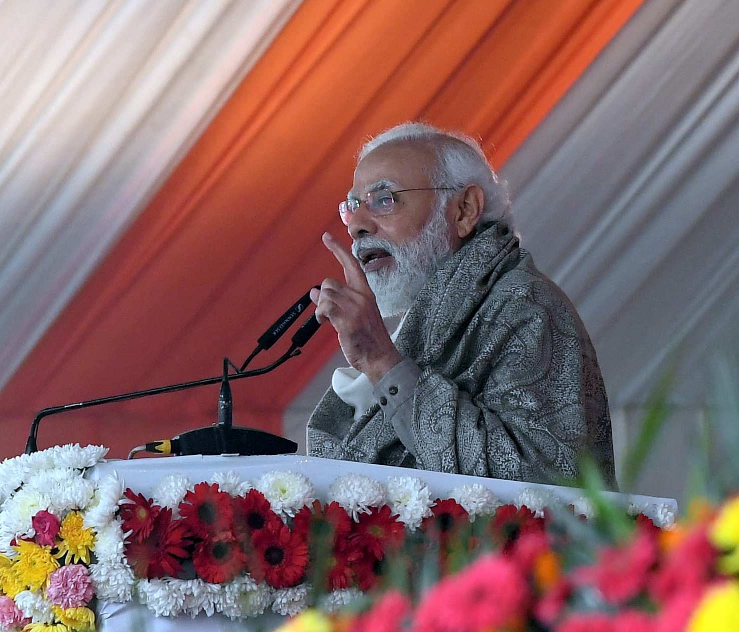 Kanpur: Prime Minister Narendra Modi addresses while inaugurating the various developmental projects, in Kanpur, Uttar Pradesh on December 28, 2021. (Photo: PIB/IANS)
